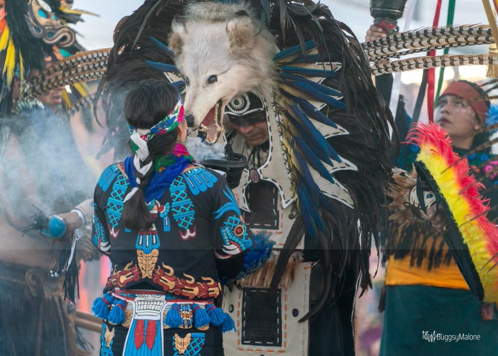 Ceremonial gathering with wolf headdress and copal smoke